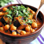 Eggplant and Chickpea Stew (Vegan) 2 tbsp olive oil 1 large onion, chopped 3 cloves garlic, minced 1 large eggplant, chopped 2 cups chopped tomatoes 2 cups cooked chickpeas 2 cups vegetable broth 1 tsp ground cumin 1 tsp paprika Salt and pepper, to taste Fresh cilantro, for garnish In a large pot, heat olive oil over medium heat. Add onion and garlic, and cook until softened, about 5 minutes. Stir in eggplant, tomatoes, chickpeas, vegetable broth, cumin, and paprika. Bring to a boil, then reduce heat and simmer for 20-25 minutes, until eggplant is tender. Season with salt and pepper. Garnish with fresh cilantro before serving.