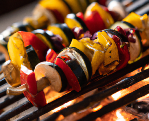 Grilled Vegetable Skewers (Vegan) 5 cups chopped bell peppers 5 cups chopped zucchini 5 cups chopped red onion 5 cups cherry tomatoes 10 wooden or metal skewers bbq fire warm light