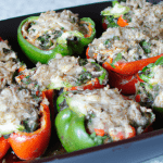 Spinach and Mushroom Stuffed Peppers (Vegetarian) 4 large bell peppers, tops removed and seeds cleaned out 1 tbsp olive oil 1 large onion, chopped 2 cloves garlic, minced 2 cups chopped mushrooms 2 cups chopped spinach 1 cup cooked brown rice 1 cup grated mozzarella cheese Salt and pepper, to taste Preheat oven to 350°F. In a large skillet, heat olive oil over medium heat. Add onion and garlic, and cook until softened, about 5 minutes. Stir in mushrooms and cook until tender, about 5-7 minutes. Stir in spinach and cook until wilted, about 2-3 minutes. Remove from heat and stir in cooked brown rice and 1/2 cup of mozzarella cheese. Season with salt and pepper. Stuff each bell pepper with the spinach and mushroom mixture. Place stuffed peppers in a baking dish and top with the remaining mozzarella cheese. Cover with aluminum foil and bake for 30-35 minutes, until peppers are tender. Remove foil and bake for an additional 5 minutes, until cheese is bubbly and golden.